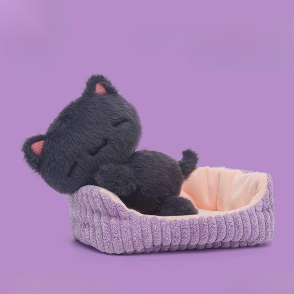 Takara sleeping black cat plush in textured basket bed