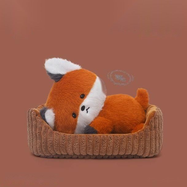 Laid-back red fox plush toy resting in corduroy basket, 18cm